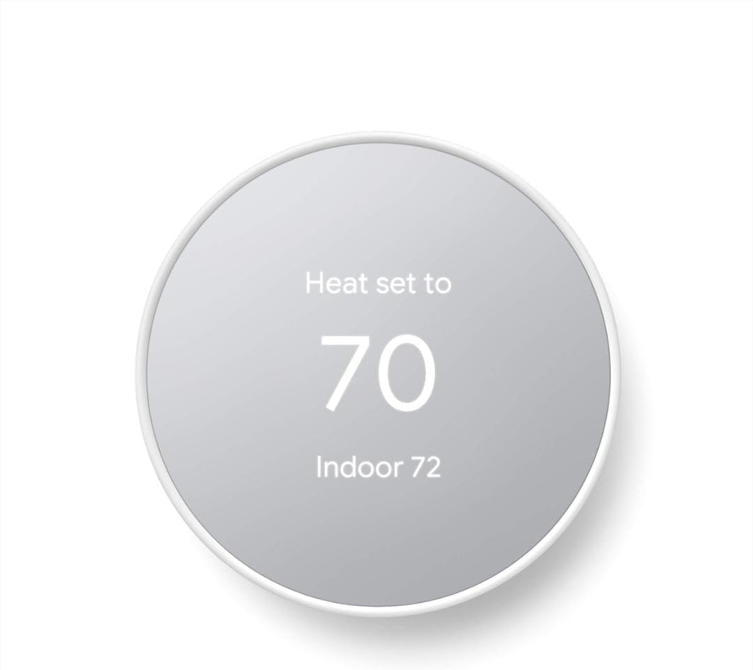 Google Nest Thermostat in Snow white mounted on a wall